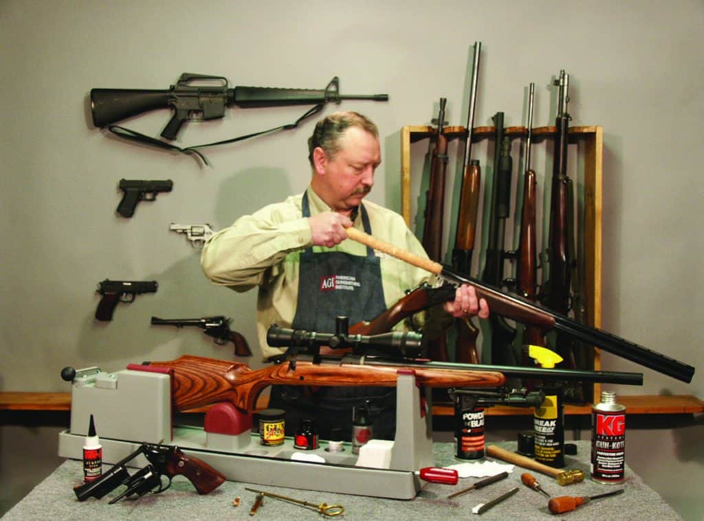 Gene Kelly Cleaning a Shotgun